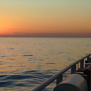 Sunset over Atlantic waters observed from a research vessel.